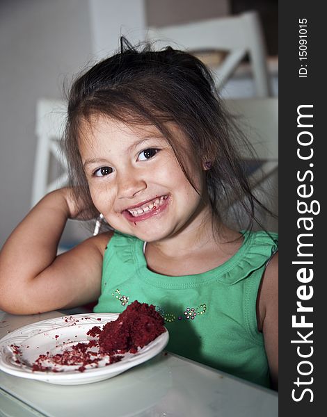 Little girl enjoying some chocolate cake. Little girl enjoying some chocolate cake