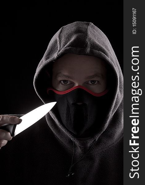Man with knife and hoody, concept of danger. Man with knife and hoody, concept of danger