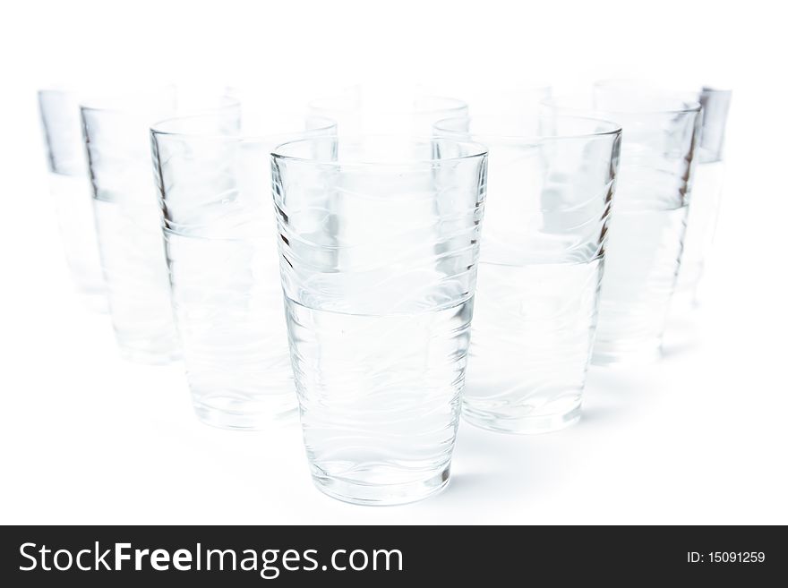 Many glasses of clean water isolated on white