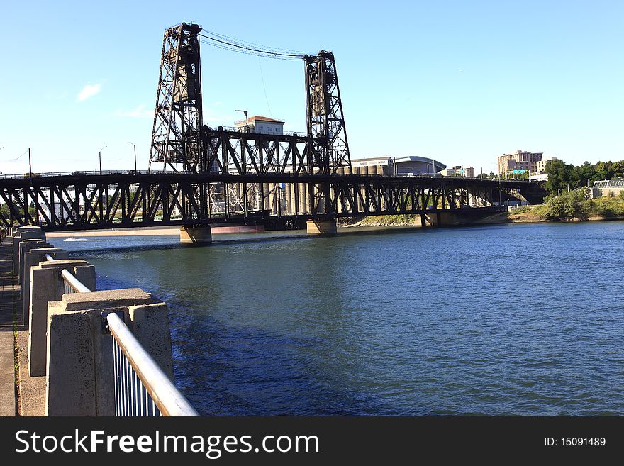 The Steel bridge seen from the promenade and park in Portland OR. The Steel bridge seen from the promenade and park in Portland OR.