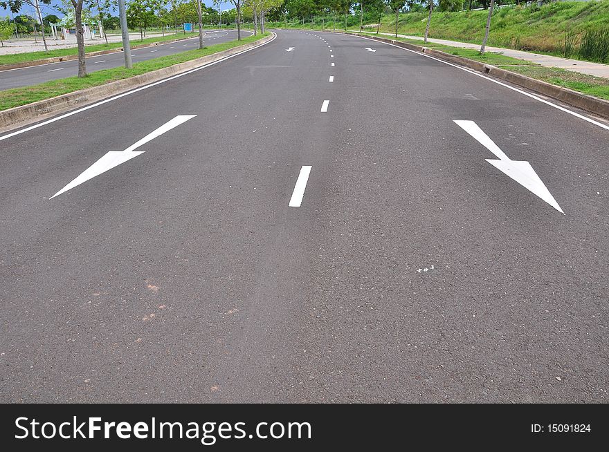 Arrow traffic symbol in asphalt road. Arrow traffic symbol in asphalt road