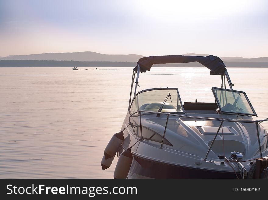 Boat on the lake with the sunset in the background