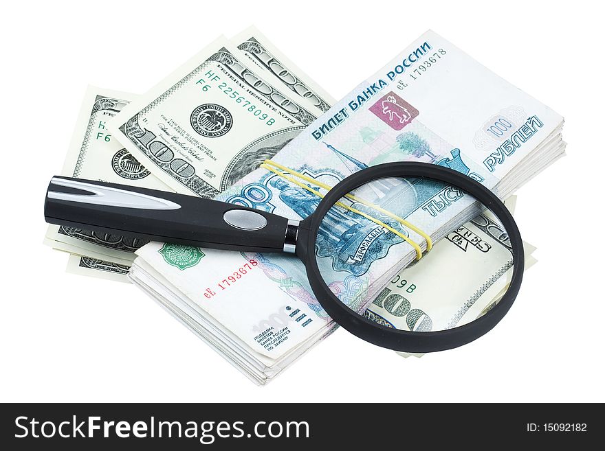 Dollars and roubles and magnifying glass on white background