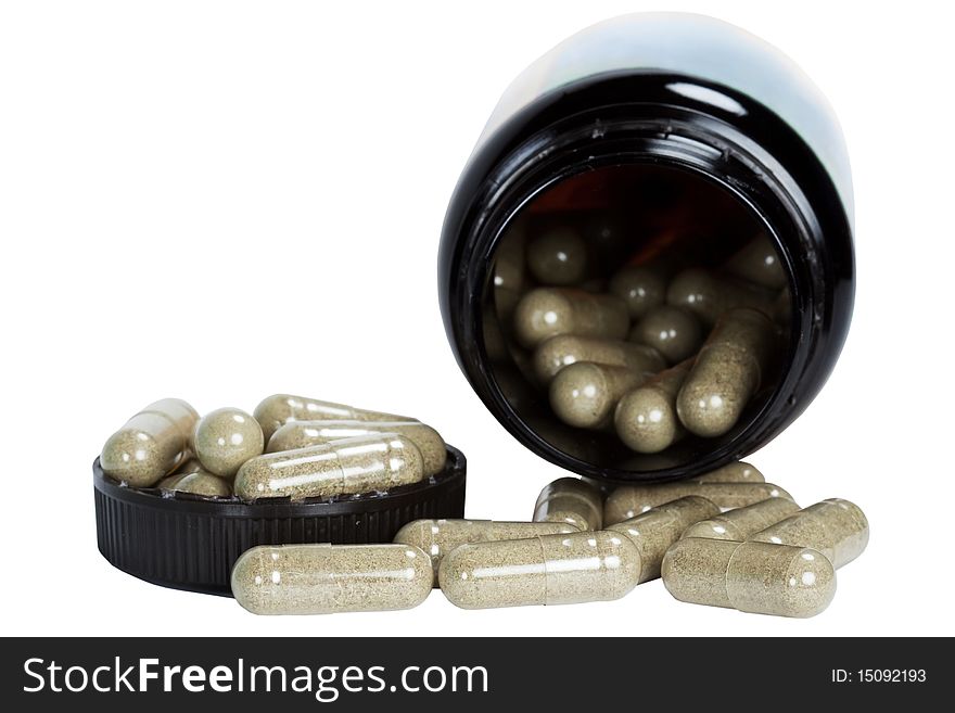 Capsules with medicinal herb in bank with lid on white background