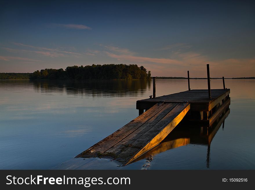 Dock on a Canadian lake at sunset. Dock on a Canadian lake at sunset
