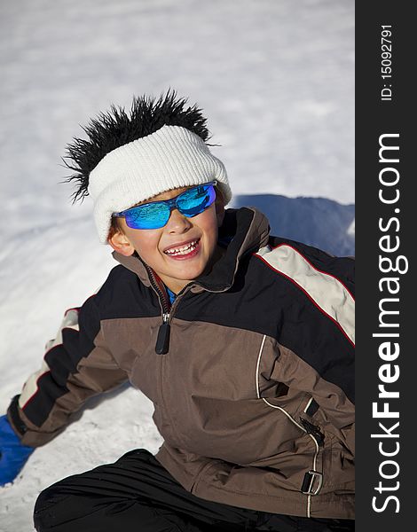 Seven Years Old Boy Playing in the Snow. Seven Years Old Boy Playing in the Snow