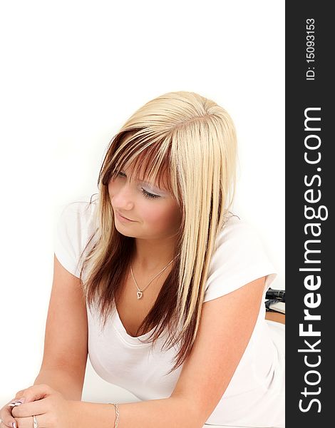 Portrait of young blonde woman relaxing, studio shot. Portrait of young blonde woman relaxing, studio shot