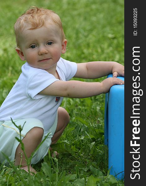 Small little boy looks happy in the nature. Small little boy looks happy in the nature