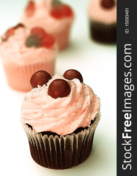 Cupcakes with Pink Frosting on White