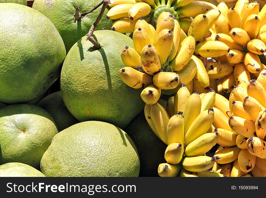 Assortment of fresh fruits consisting of
bananas and shaddock