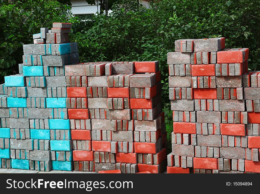 Stacks of colorful brick in construction site