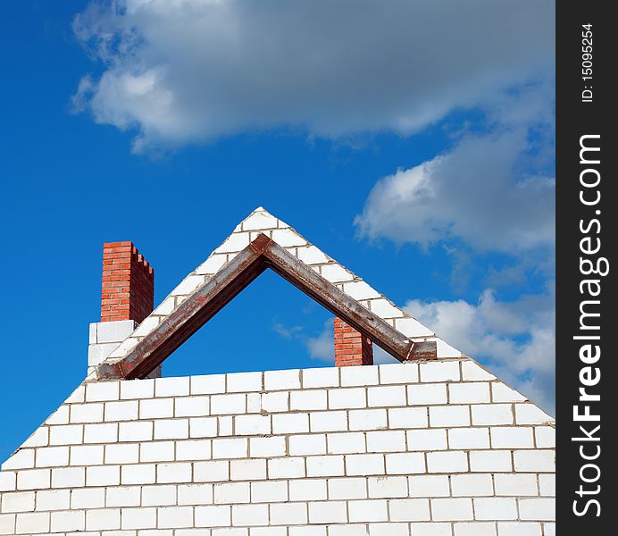 Unfinished roof on background of blue sky