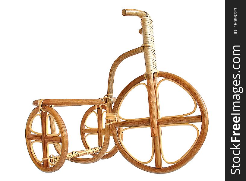 Wooden bicycle. Made by human hands from the dry wood.