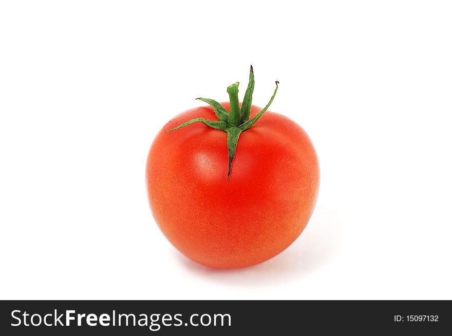 The tomato is isolated on a white background