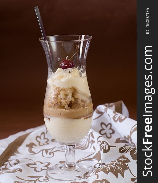 Coffee cocktail with ice and whipped cream in a high glass. Coffee cocktail with ice and whipped cream in a high glass