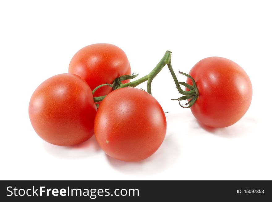 Sheaf of ripe tomatoes isolated on a white background