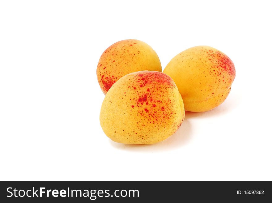 Ripe apricots are isolated on a white background. Ripe apricots are isolated on a white background