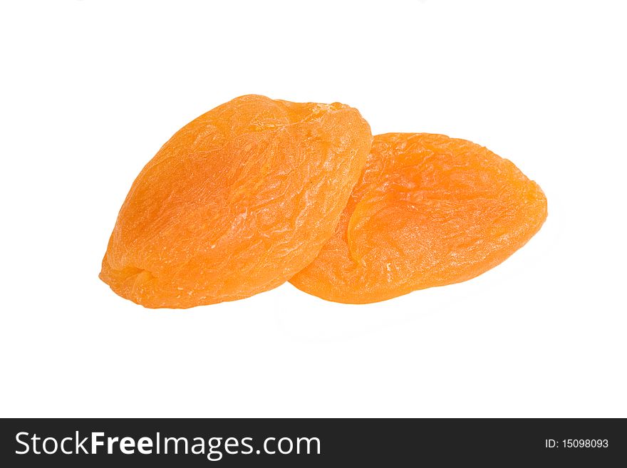 Two dried apricots isolated on a white background