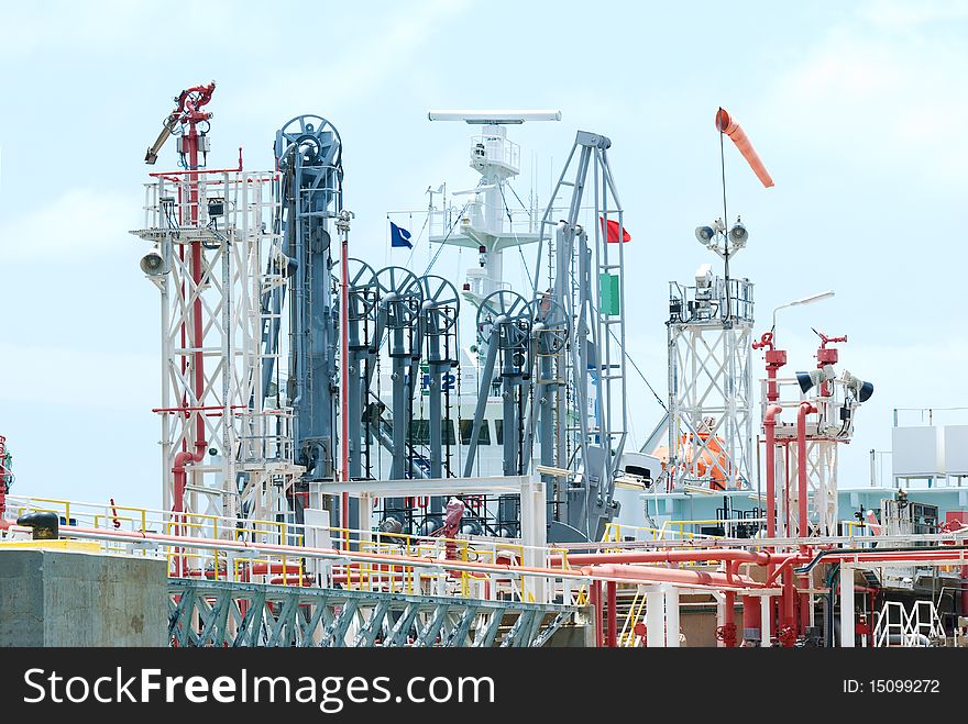 Detailed photo of oil terminal at industrial harbour.