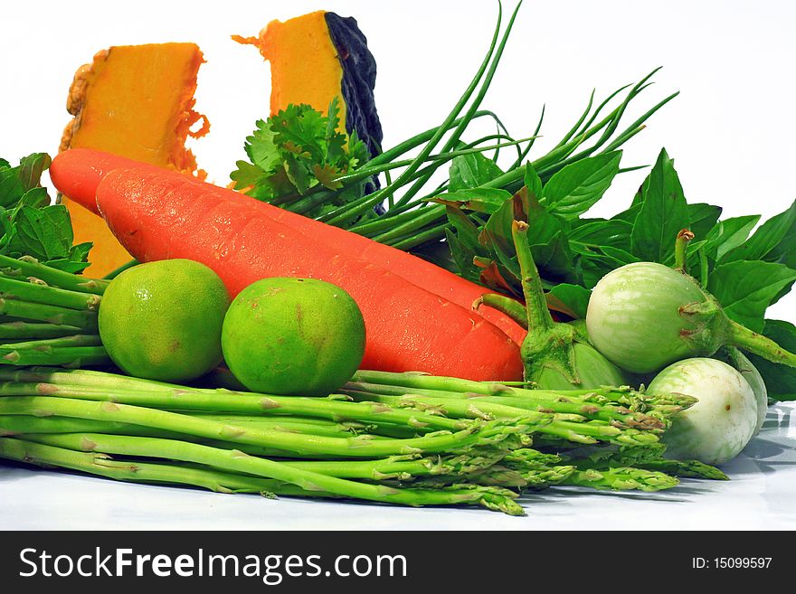 Many fresh vegetables on white background.