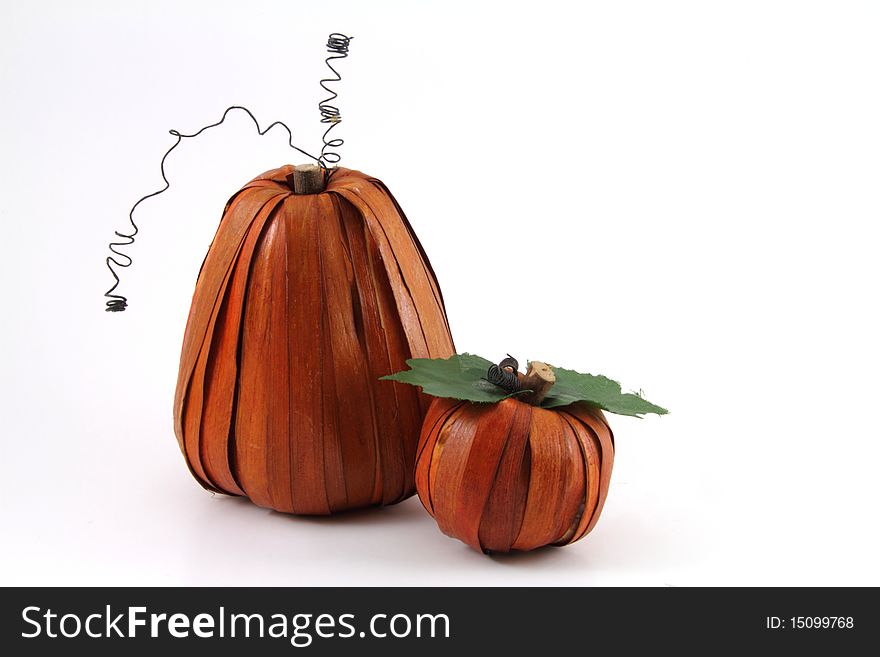 A pair of artistically created pumpkins on a white background. A pair of artistically created pumpkins on a white background.