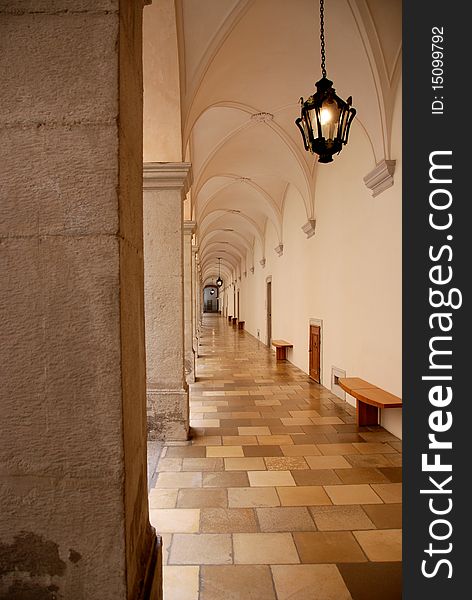 A vaulted hallway at Melk Abbey stretches into the distance.