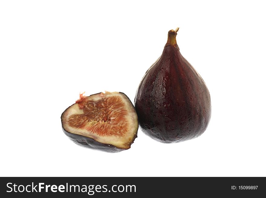 One full fig and half fig on white. One full fig and half fig on white