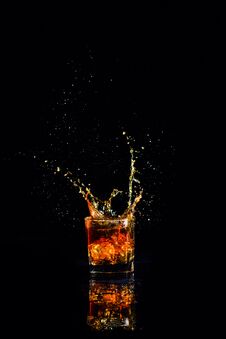 Whiskey With Splash On Black Background, Brandy In A Glass Royalty Free Stock Image Whiskey With Splash On Black Background, Brandy In A Glass Royalty Free Stock Image