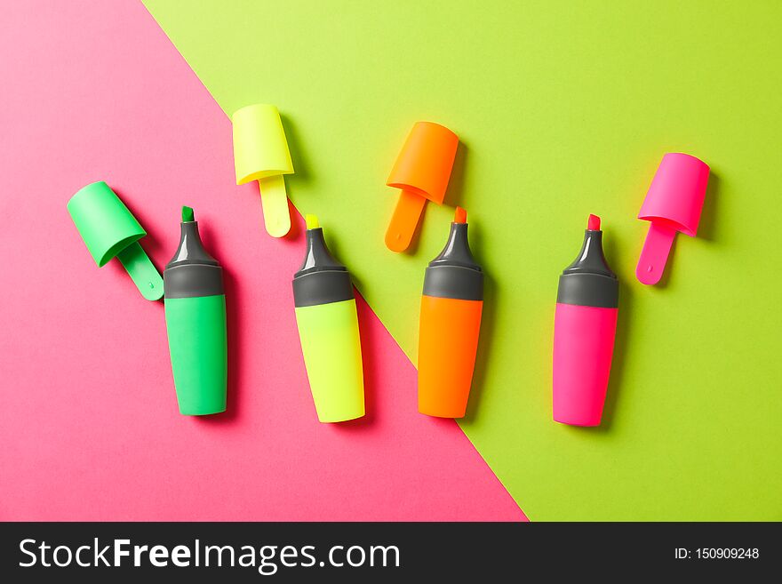 Open highlighters on two tone background, space for text