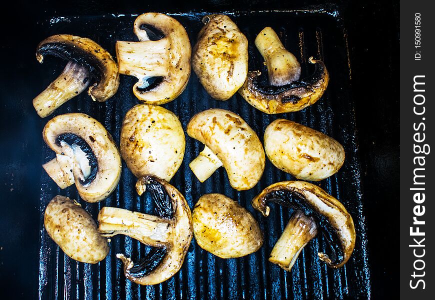 Mushrooms, mushrooms, grilled.  Cooking mushrooms on the grill in the restaurant