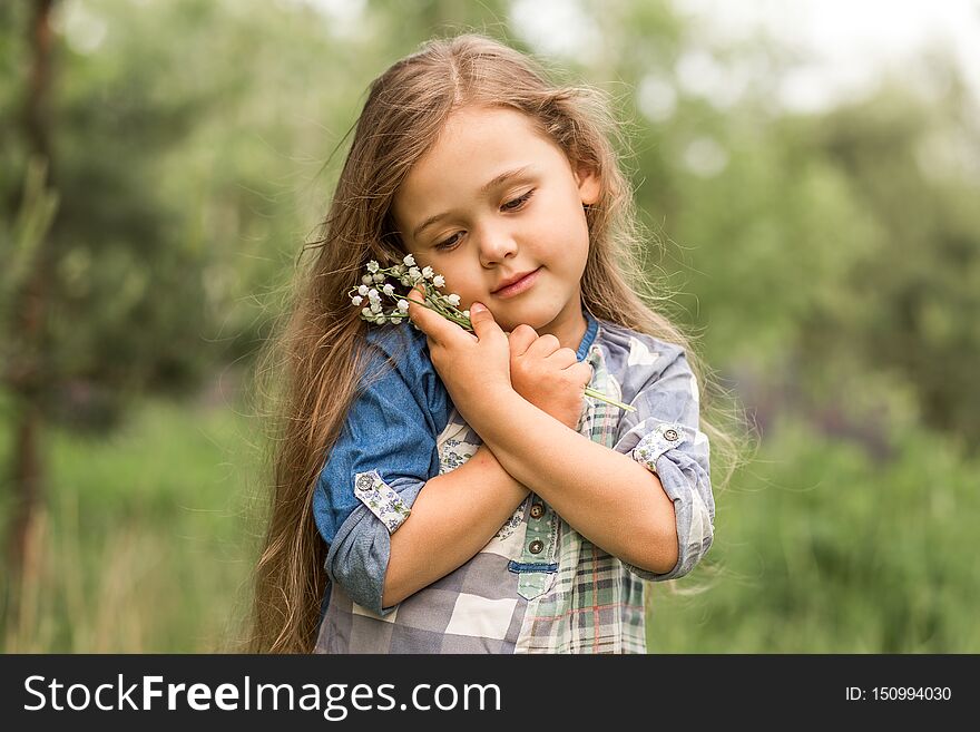 Girl With Lily Of The Valley In Nature