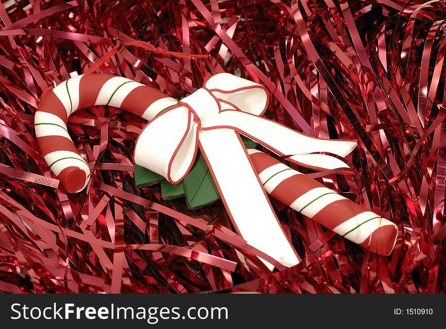 Photo of a Candy Cane on Red Tinsel - Christmas Related
