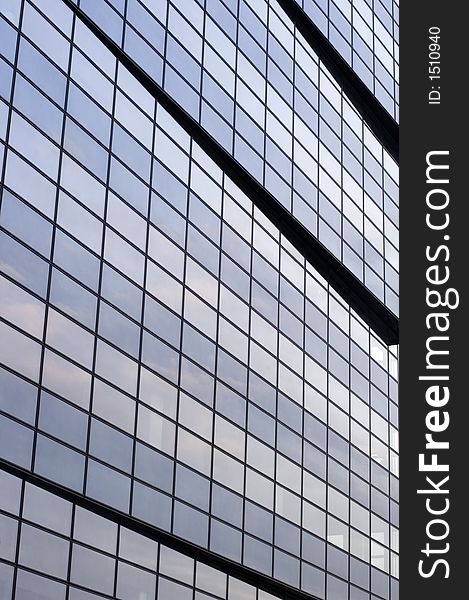 Abstract reflecting windows on large business building