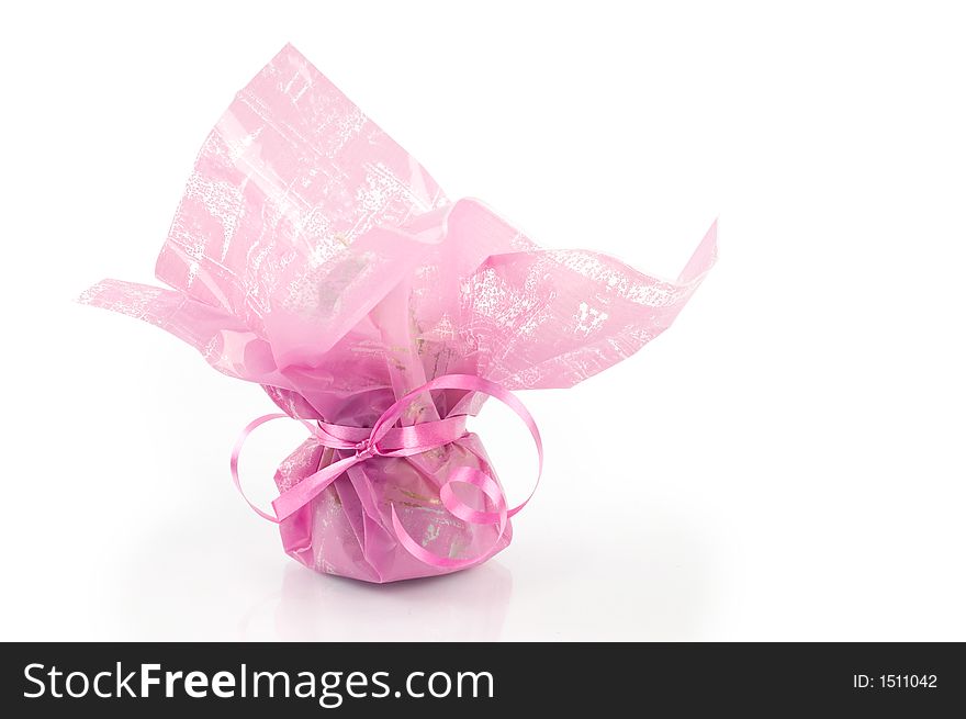 Pink present package against white background, isolated. Pink present package against white background, isolated