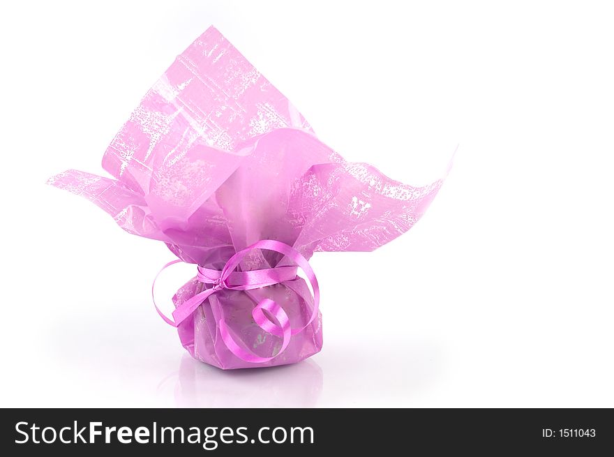 Pink present package against white background, isolated. Pink present package against white background, isolated