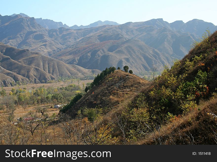 Landscape of mountains,country house,smoke and sky in autumn. Landscape of mountains,country house,smoke and sky in autumn