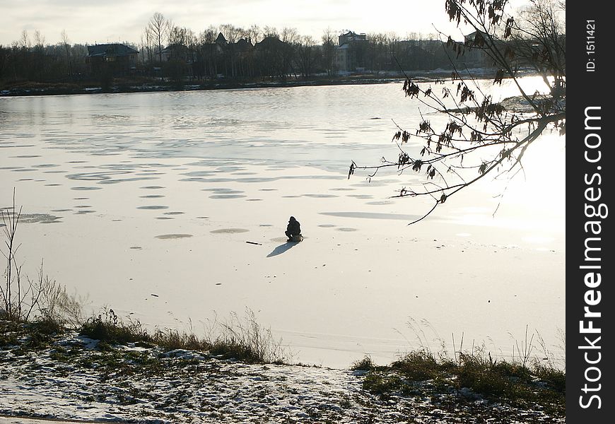 Winter fishing ( fisherman,  river, Yaroslavl,  beginning of winter, Russia). Winter fishing ( fisherman,  river, Yaroslavl,  beginning of winter, Russia)