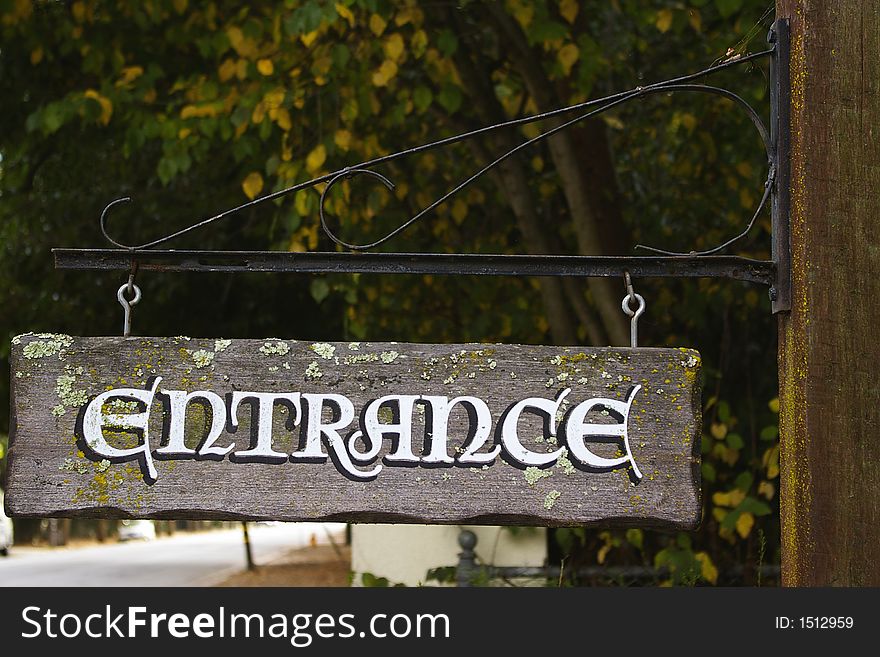 Vintage entrance road sign in suburban area