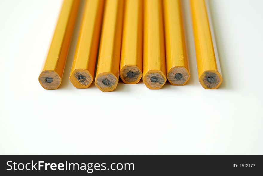 Row of number two pencils on a white background. Row of number two pencils on a white background