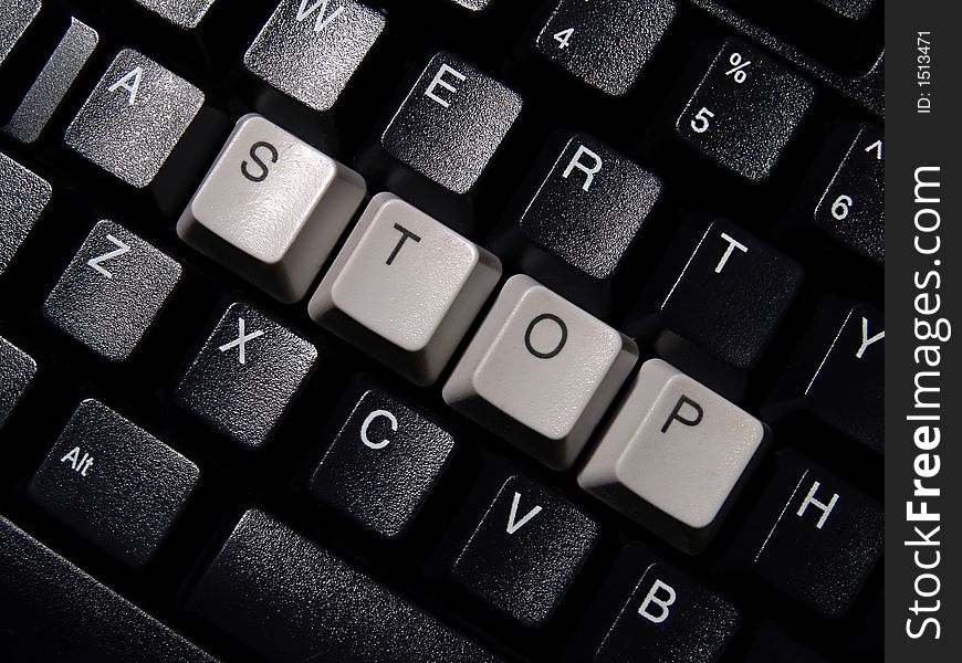 Black computer keyboard, with stop word