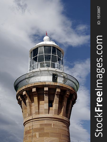 Top Of A Lighthouse Brick Tower In Front Of A Cloudy Sky, Sydney, Australia