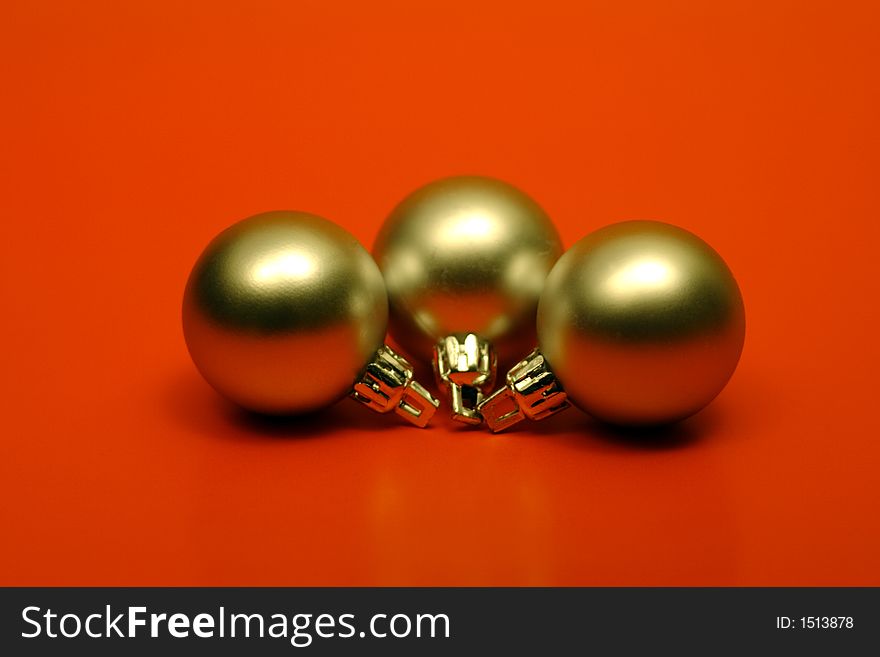 Gold christmas balls on red