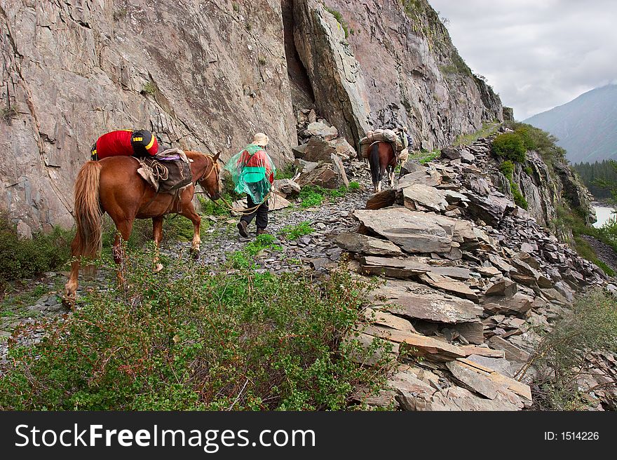 Road, mountains, horse and women.