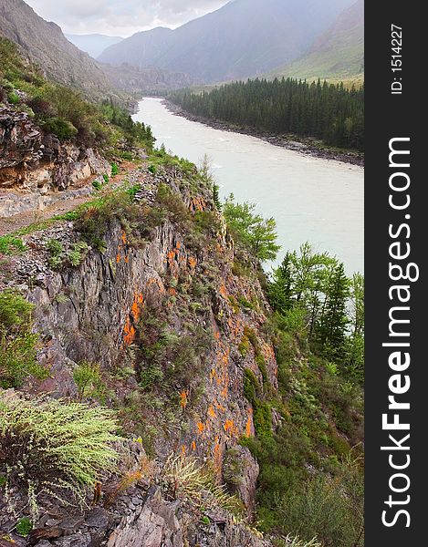 Road, mountains and river.