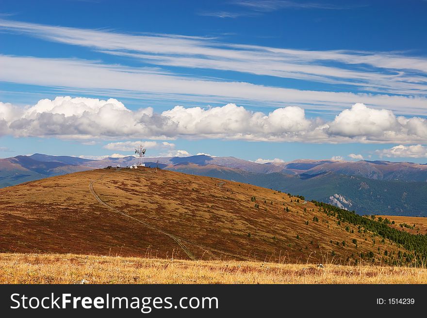 Blue Sky, Clouds And Mountains.