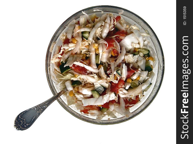 Mixed salas with cabbage, tomatos, and cucumbers in a glass dish. Mixed salas with cabbage, tomatos, and cucumbers in a glass dish
