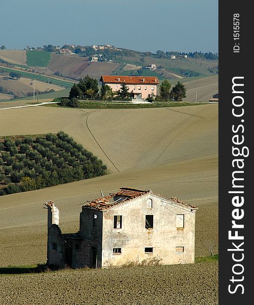 A ruined colonic house with a new one on hills - Jesi - ITALY. A ruined colonic house with a new one on hills - Jesi - ITALY