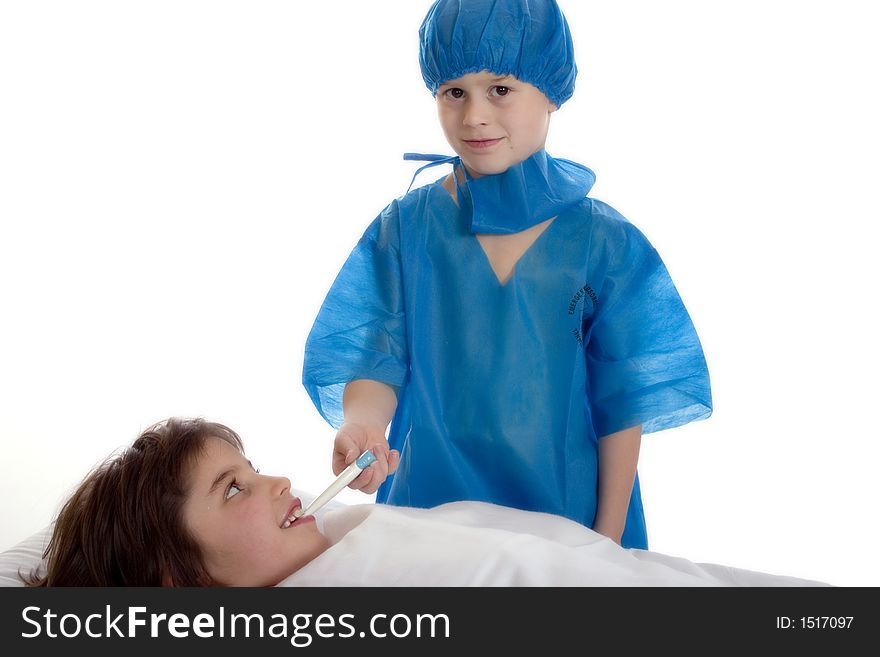 Young doctor, dressed in scrubs, taking the temperature of his patient. Isolated against a white backdrop.