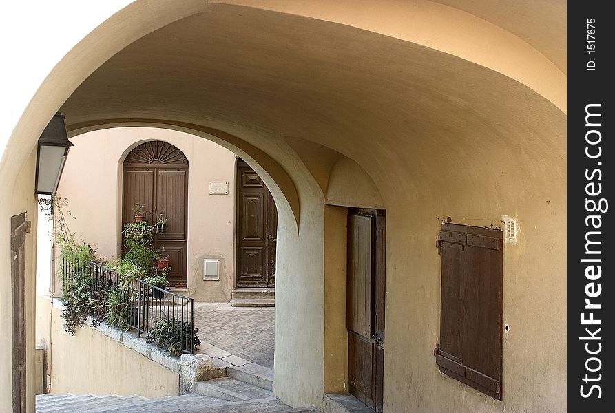 View through an archway in mediterranean village. View through an archway in mediterranean village