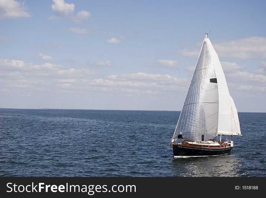 Photo of a sailboat passing by the Pier in St. Petersburg, Florida. Photo of a sailboat passing by the Pier in St. Petersburg, Florida